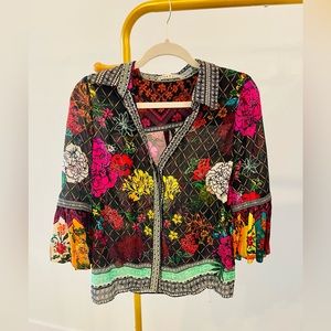 Alice + Olivia blouse. Colorful with slightly oversized ruffle at wrist.